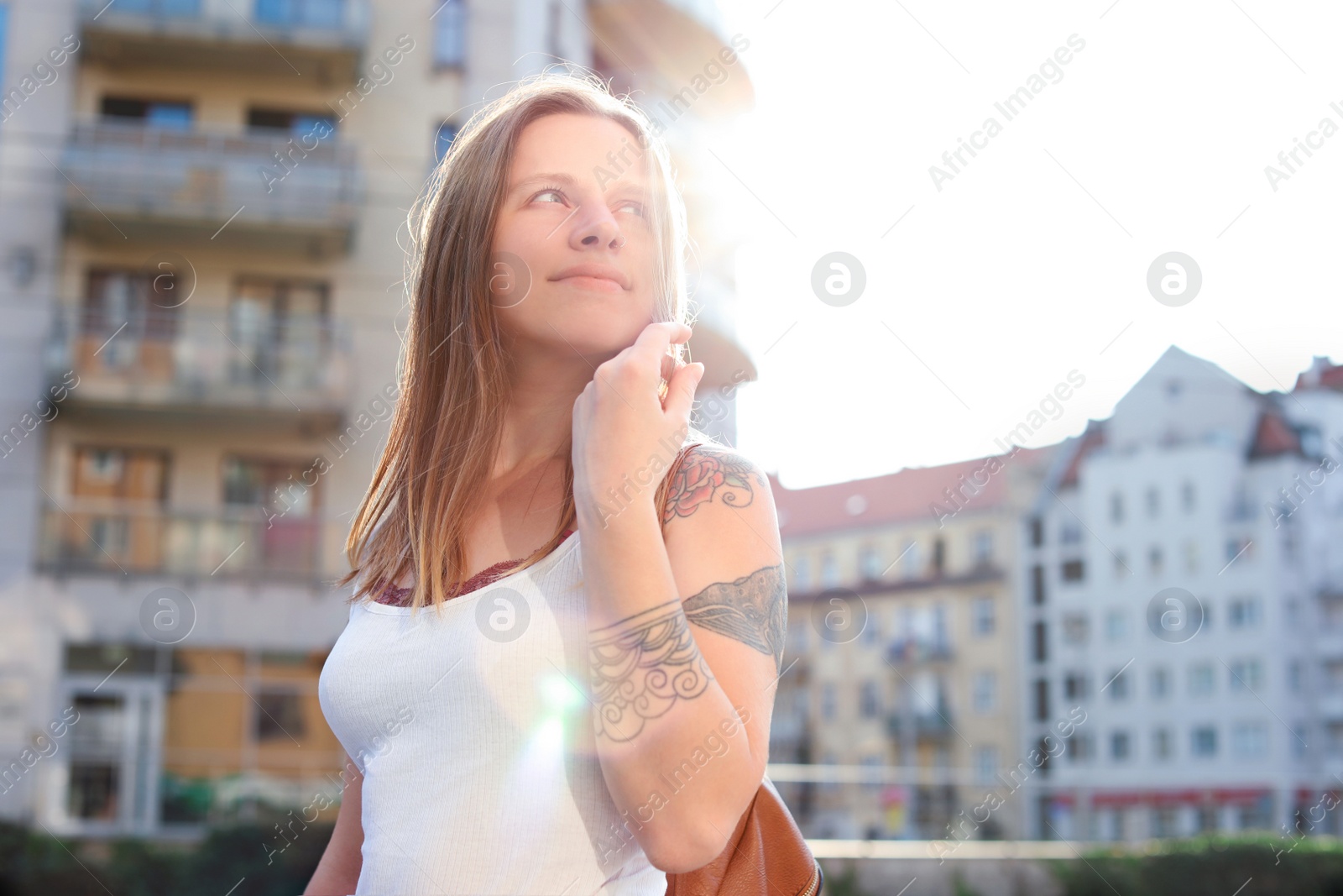 Photo of Portrait of young woman on city street