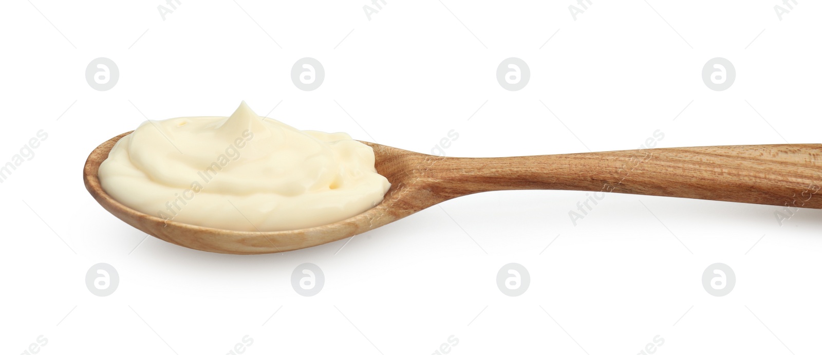 Photo of Fresh mayonnaise sauce in wooden spoon isolated on white