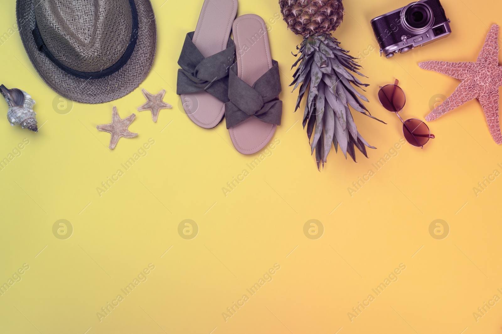 Image of Flat lay composition with beach objects on yellow background, space for text. Summer party