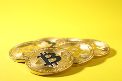 Photo of Bitcoins on color background, space for text. Digital currency