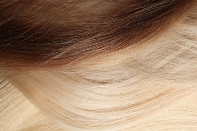 Strands of different color hair as background, closeup