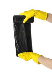 Photo of Janitor in rubber gloves holding roll of black garbage bags on white background, closeup