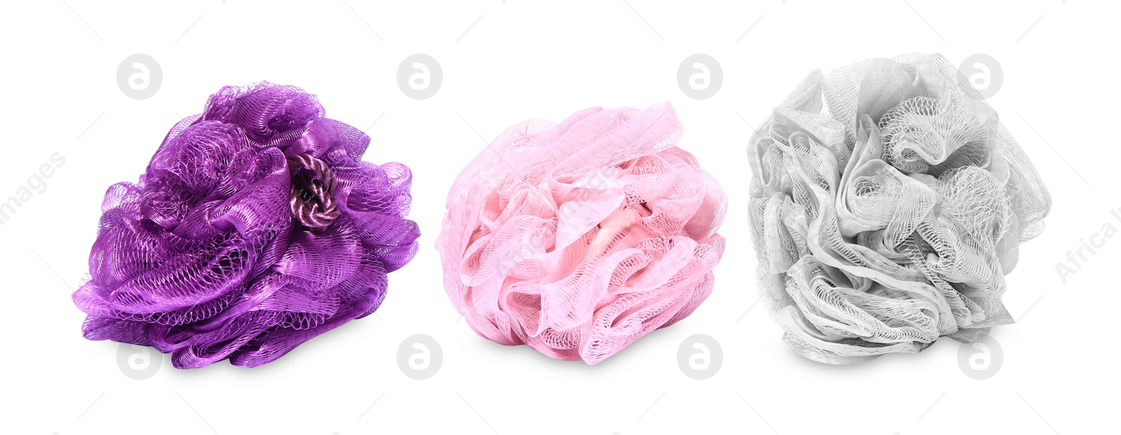 Photo of New shower puffs on white background. Personal hygiene