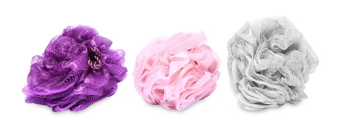 Photo of New shower puffs on white background. Personal hygiene