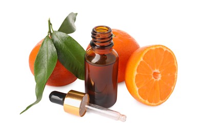 Photo of Aromatic tangerine essential oil in bottle, pipette and citrus fruits isolated on white