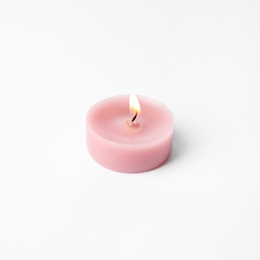Photo of Pink wax decorative candle isolated on white