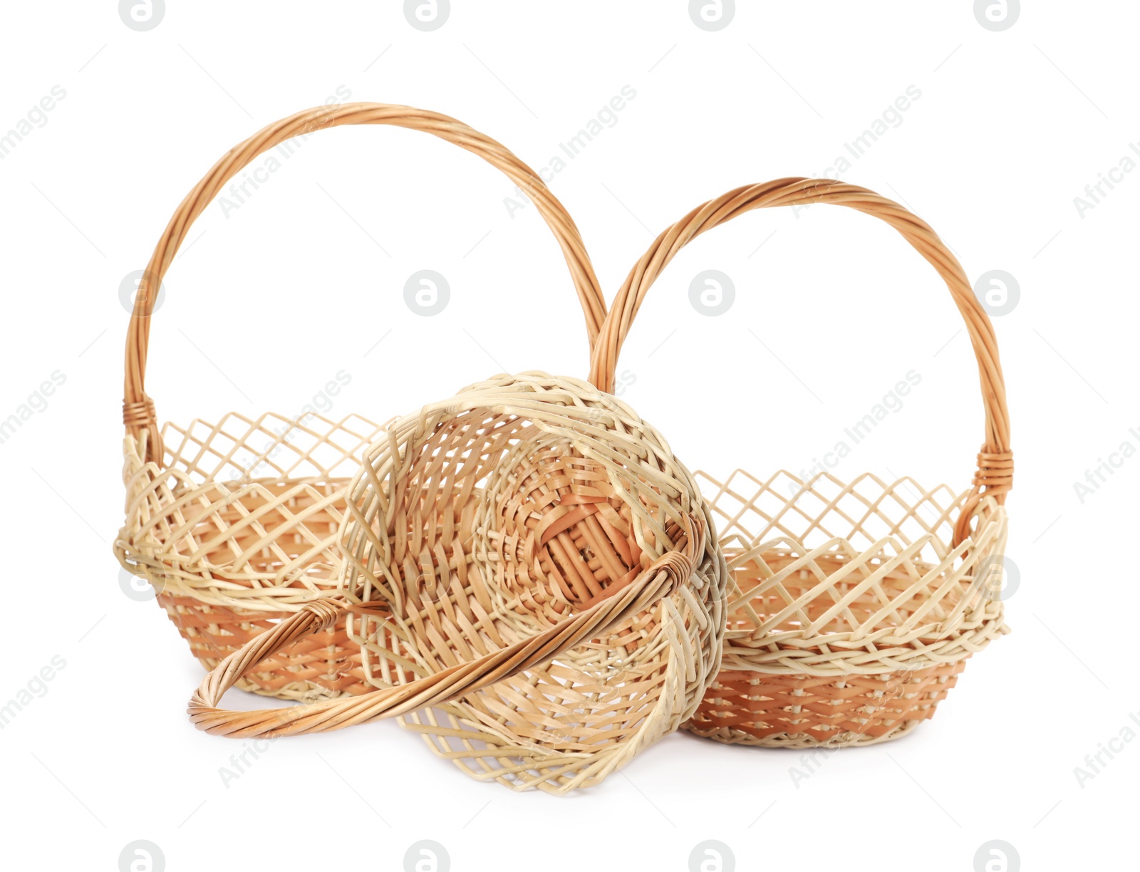 Photo of Three decorative wicker baskets on white background