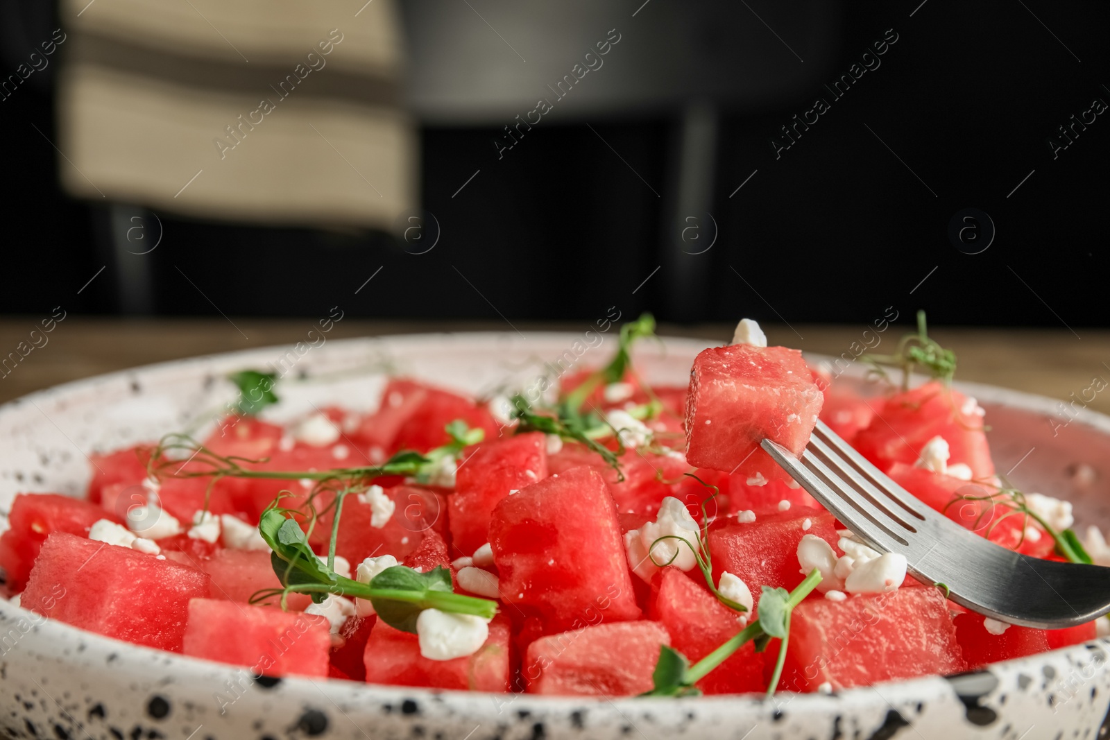 Photo of Delicious salad with watermelon served on plate, closeup