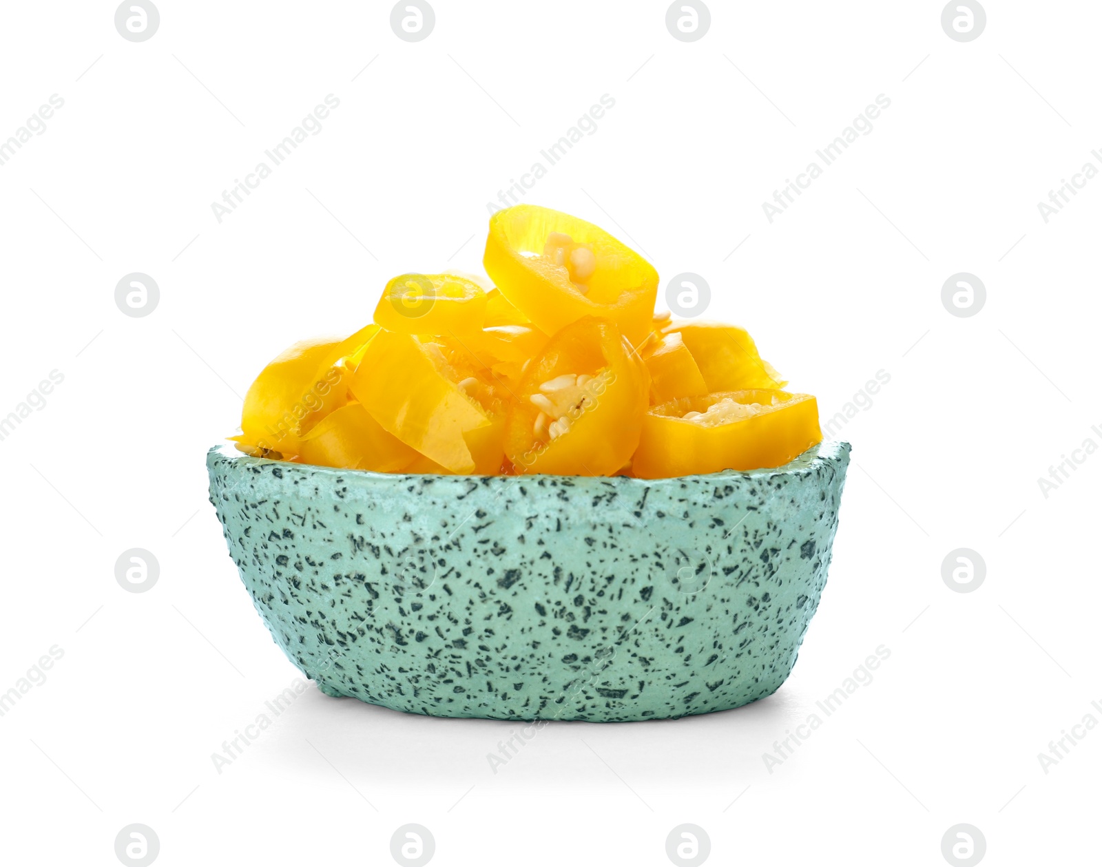 Photo of Bowl with cut chili peppers on white background