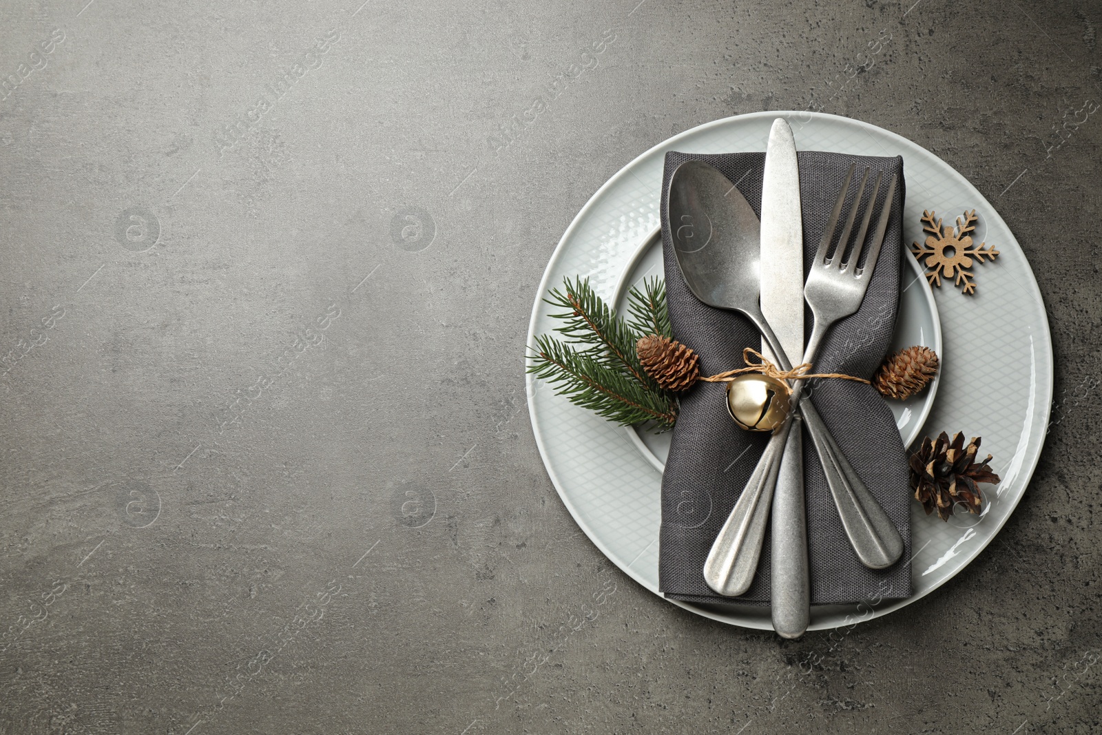 Photo of Beautiful Christmas table setting on grey background, top view. Space for text