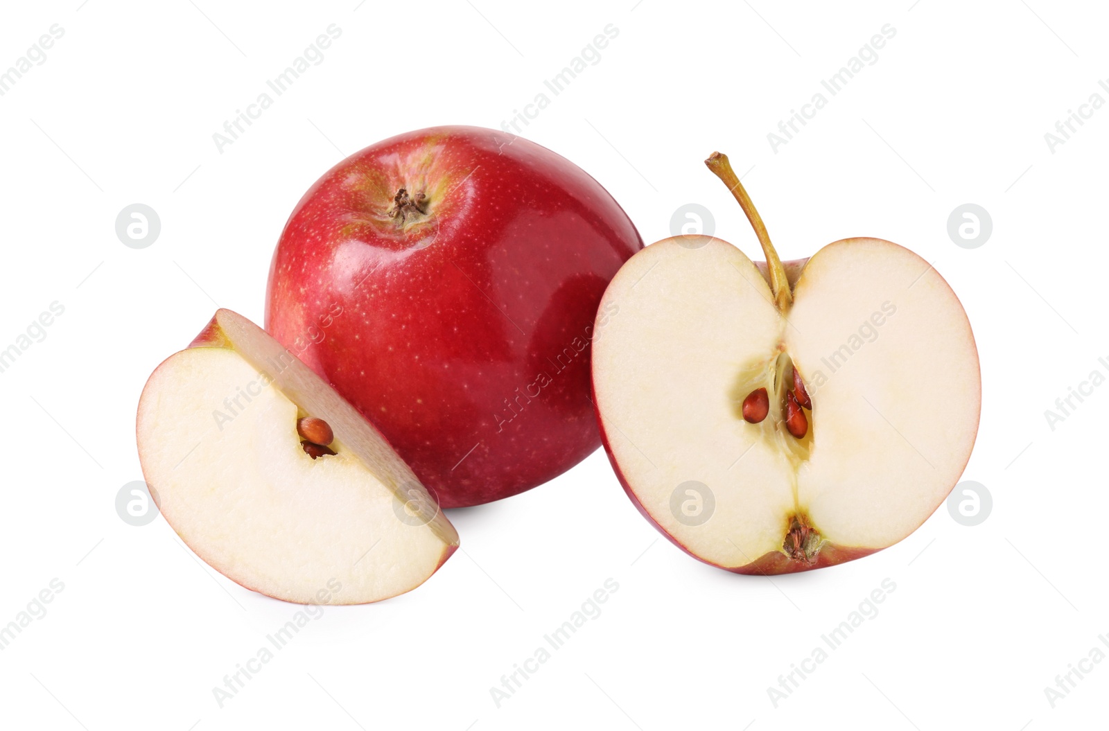 Photo of Whole and cut red apples isolated on white