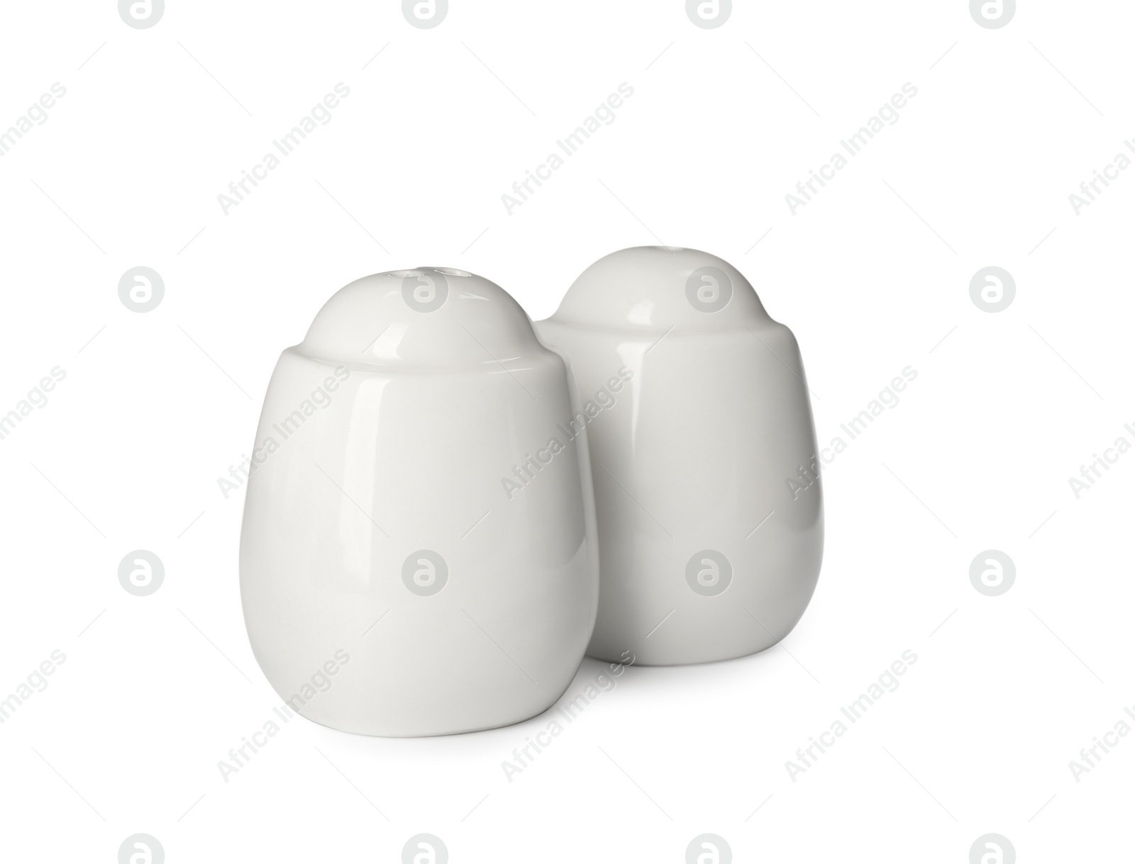 Photo of Ceramic salt and pepper shakers isolated on white