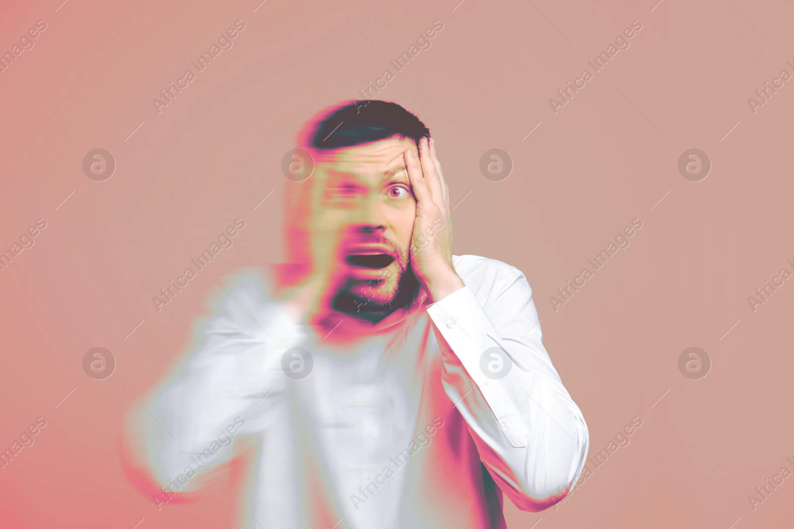 Image of Man suffering from paranoia on light coral background, glitch effect