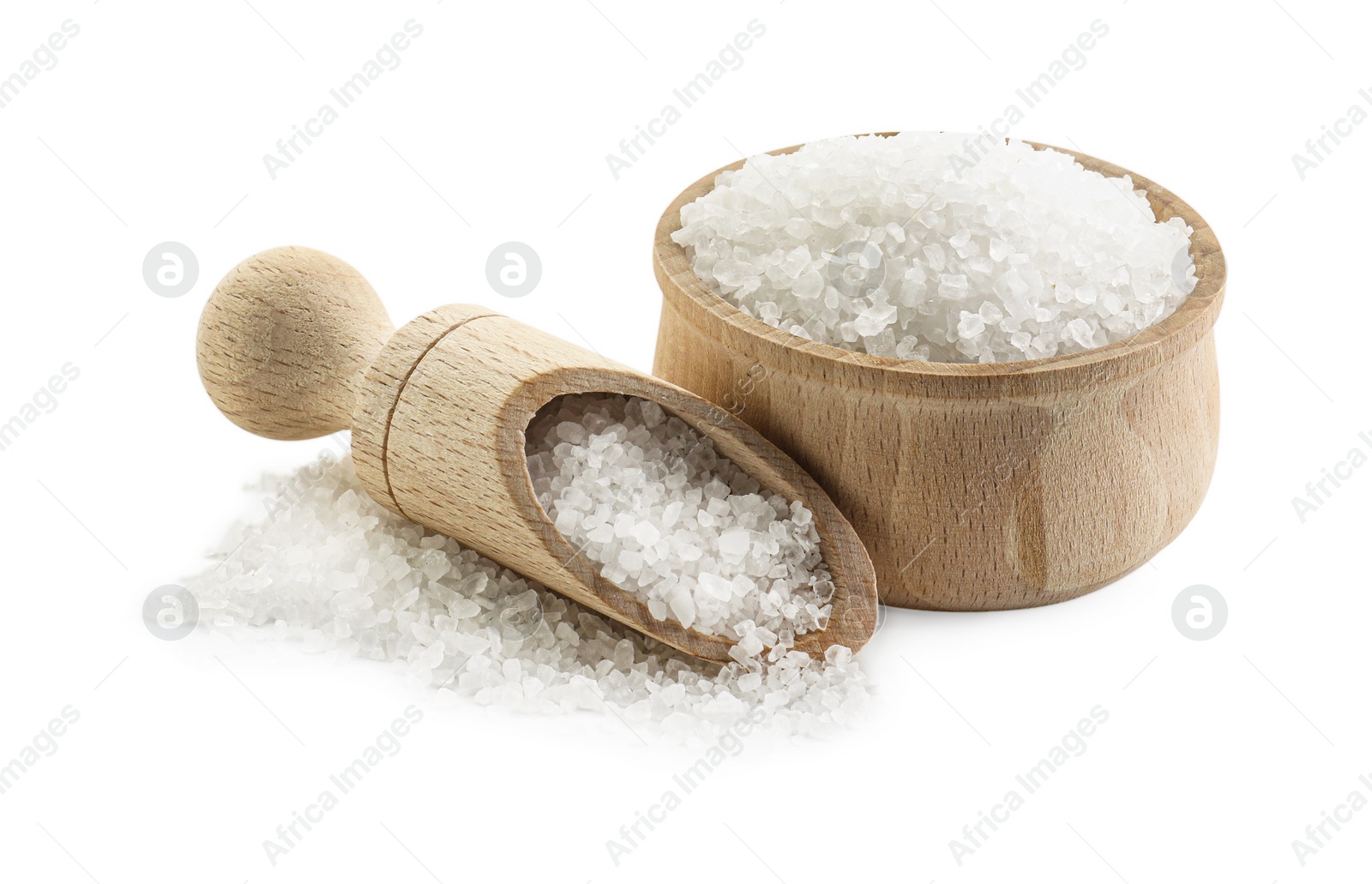 Photo of Natural salt in wooden bowl and scoop isolated on white