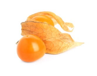 Ripe physalis fruits with dry husk on white background