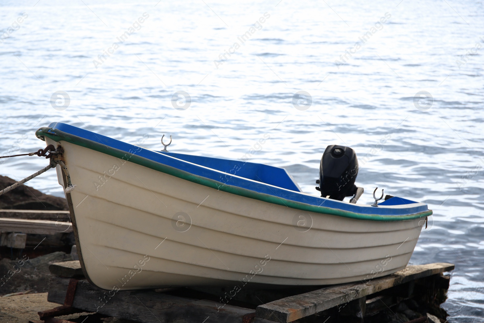 Photo of Moored boat on beach near sea outdoors