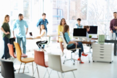 Young people having business training in office, blurred view