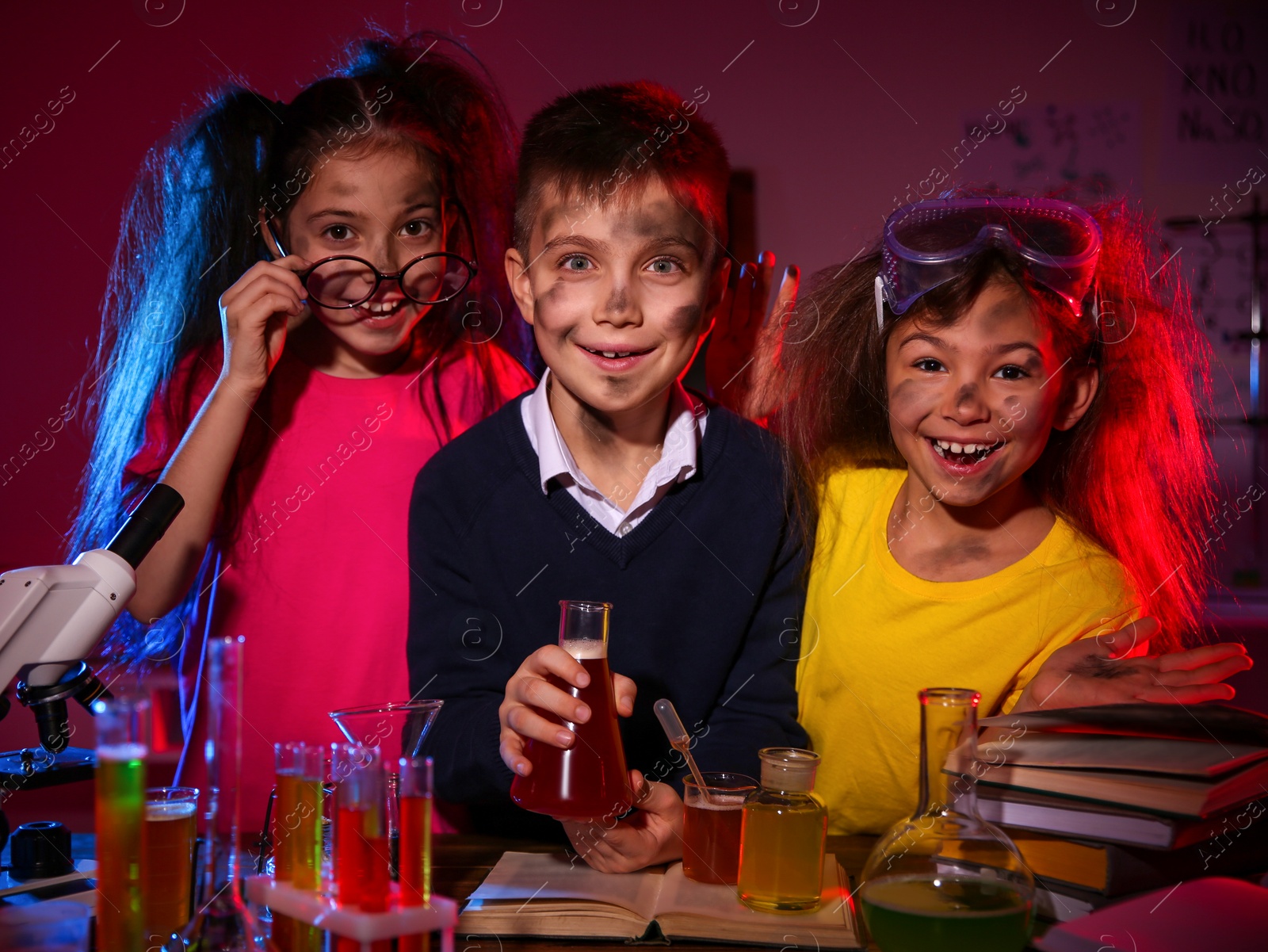 Photo of Children doing chemical research in laboratory. Dangerous experiment