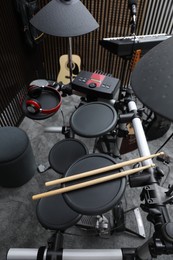 Photo of Electronic drum set at recording studio. Music band practice