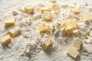 Photo of Making shortcrust pastry. Flour and butter on table