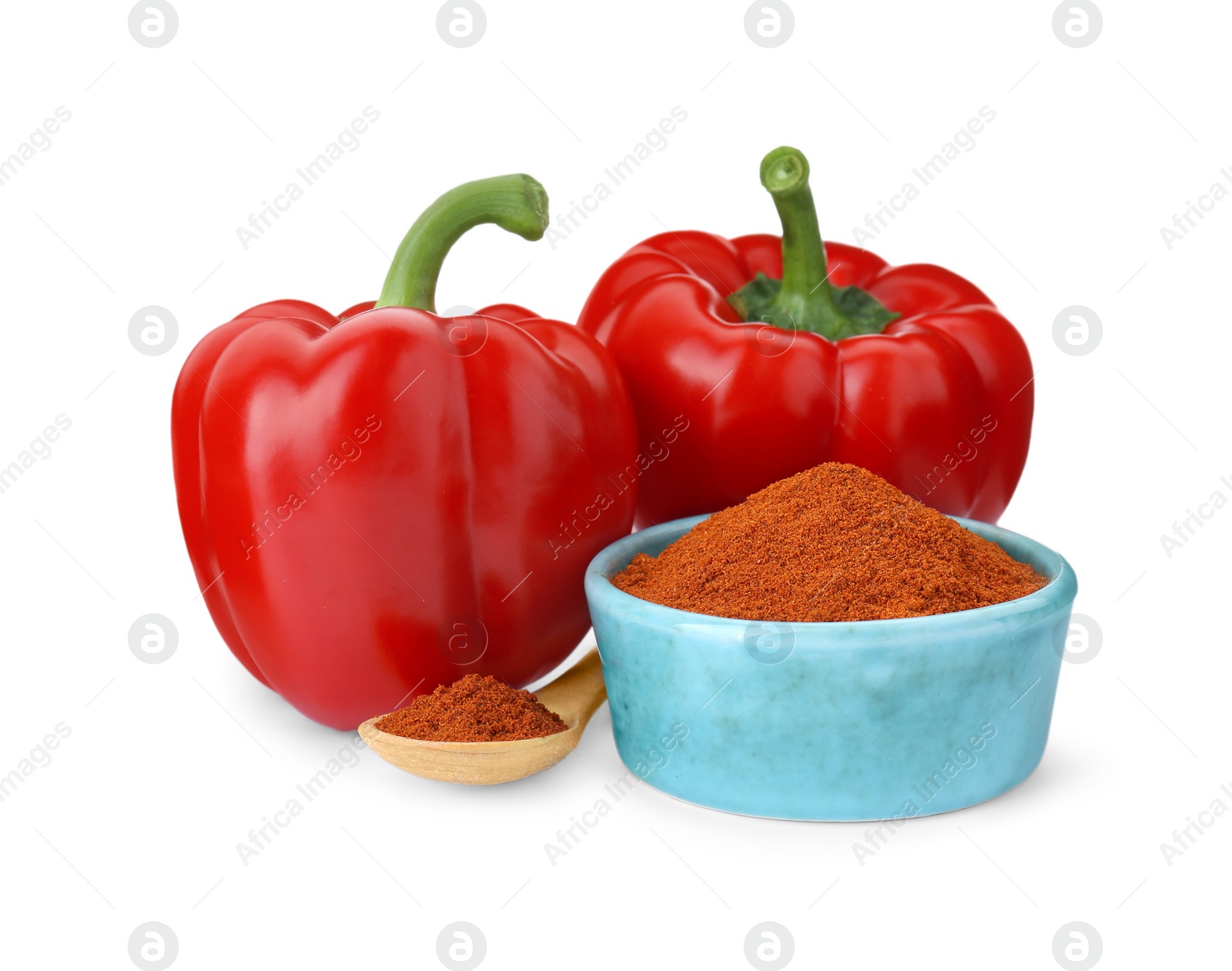 Photo of Bowl with aromatic paprika powder and fresh bell peppers isolated on white