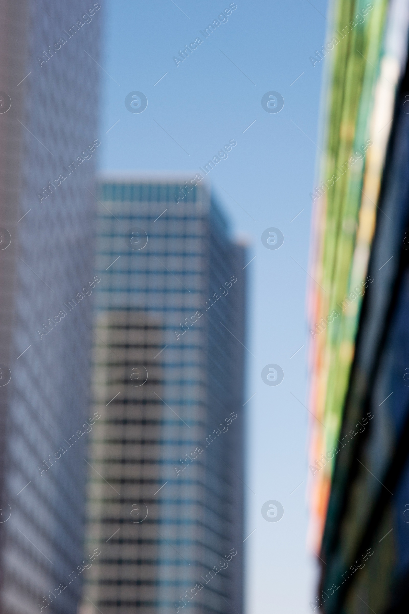Photo of Blurred view of modern buildings on sunny day
