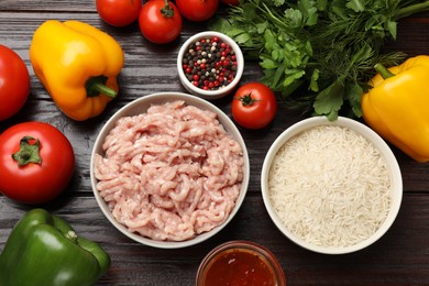 Making stuffed peppers. Ground meat and other ingredients on wooden table, flat lay