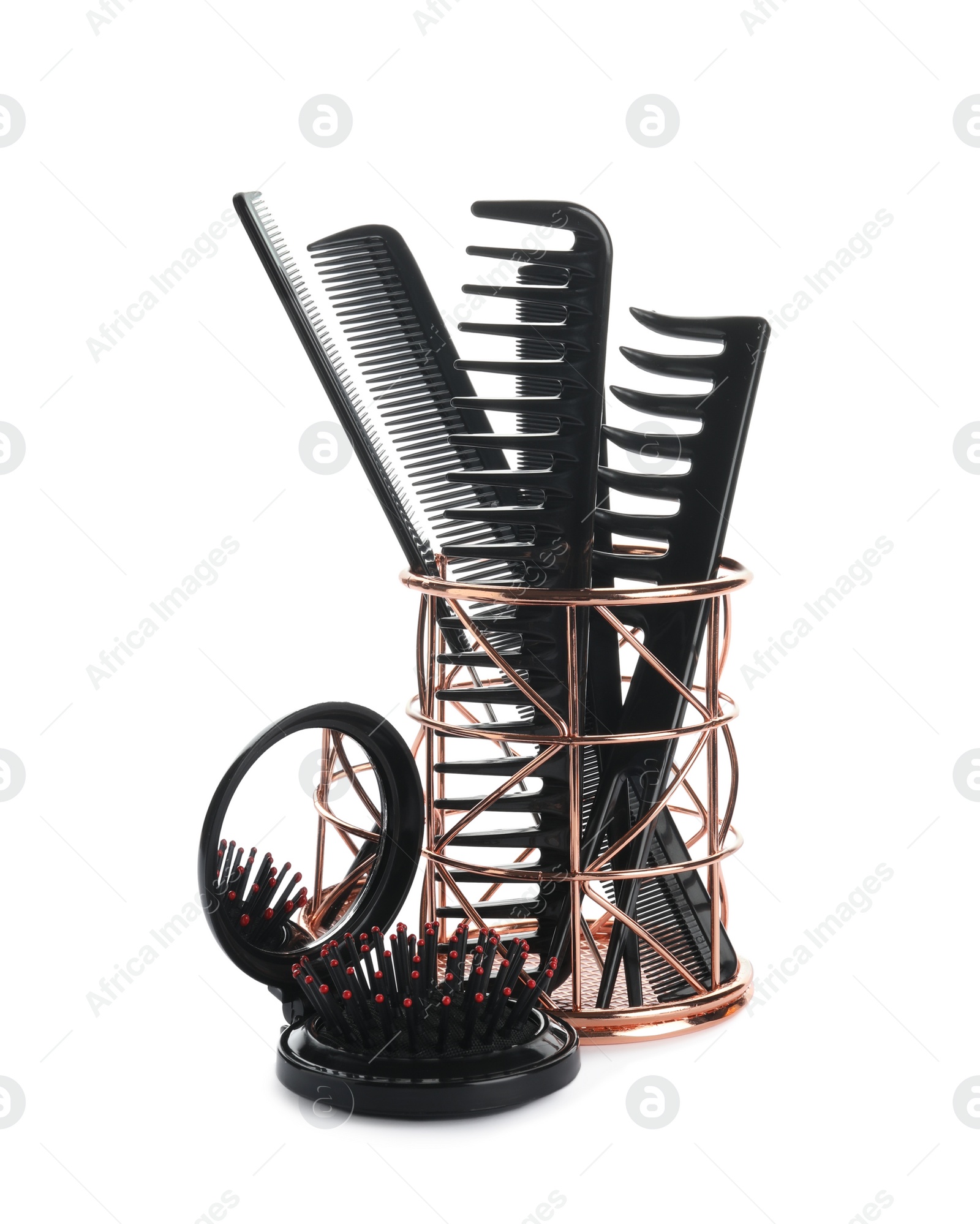 Photo of Set of professional hair combs in metal holder isolated on white