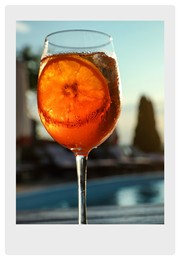 Image of Paper photo. Glass of fresh summer cocktail at poolside outdoors 