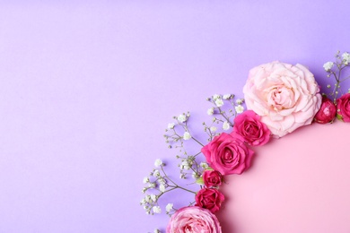 Photo of Flat lay composition with flowers and space for text on color background