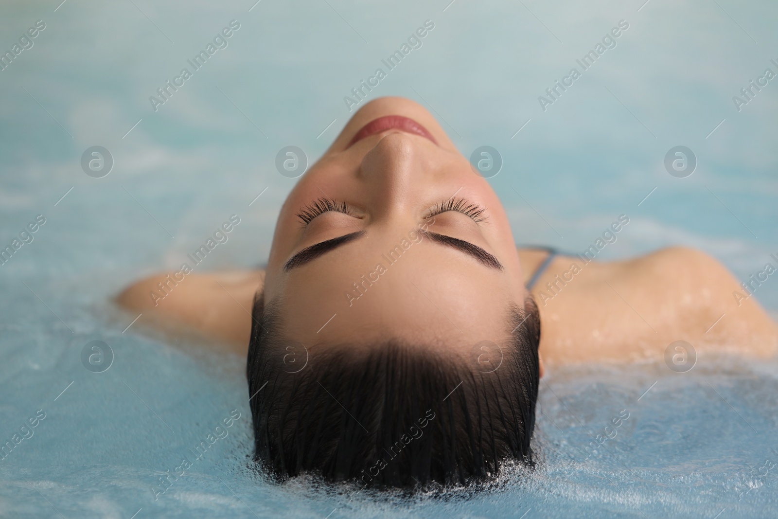 Photo of Beautiful woman relaxing in spa swimming pool