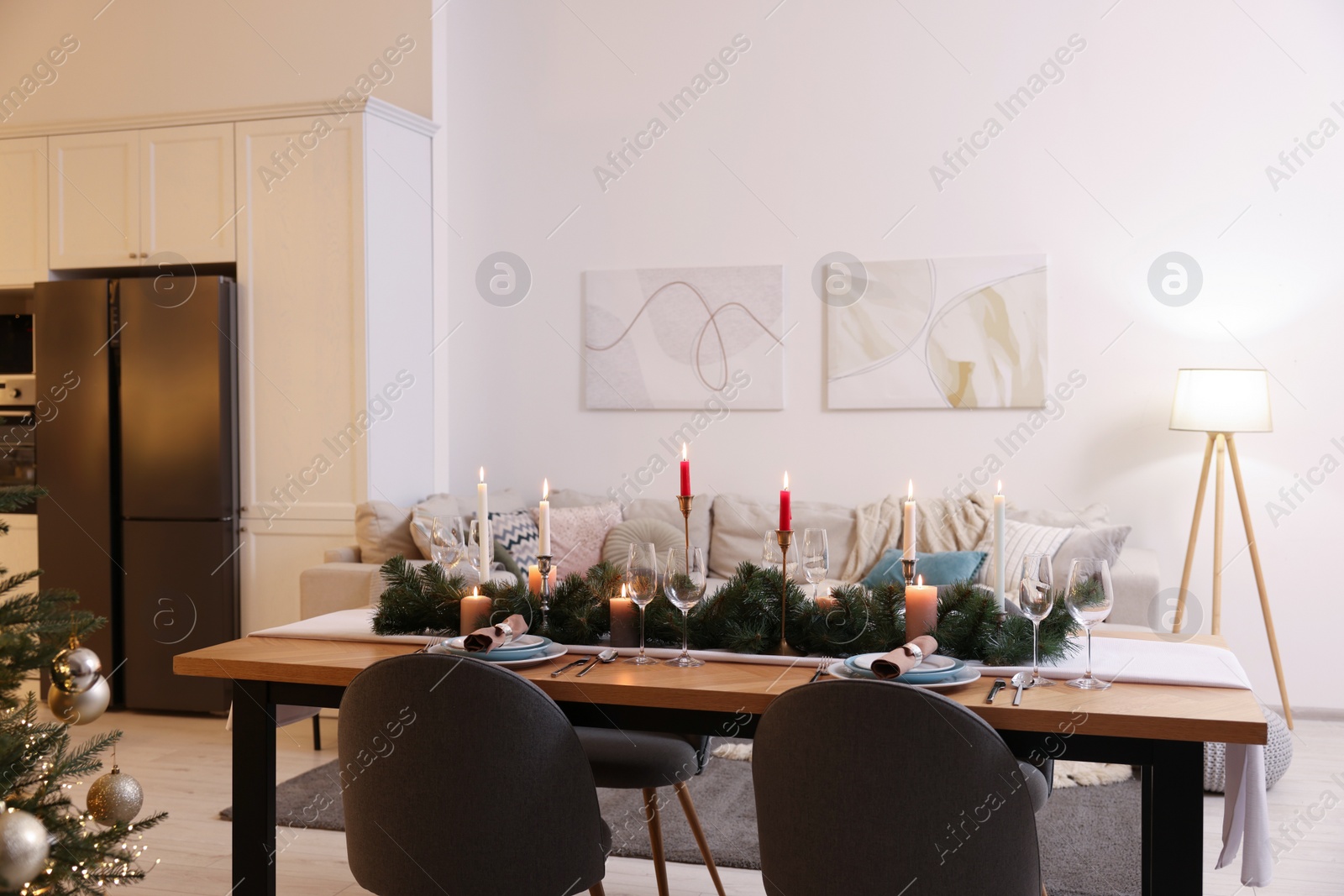 Photo of Cozy spacious kitchen decorated for Christmas. Interior design