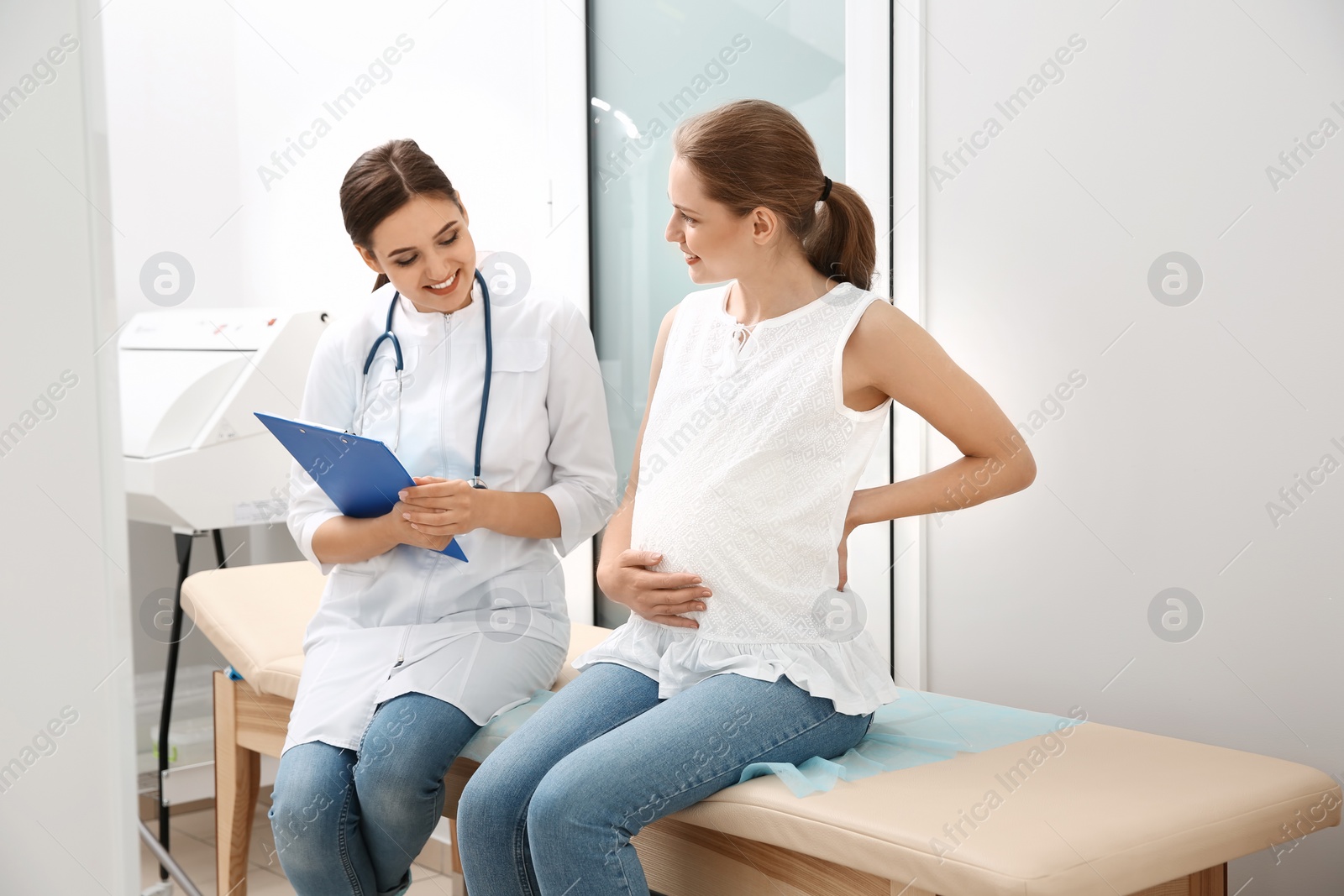 Photo of Pregnant woman having appointment at gynecologist office