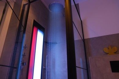 Photo of Modern shower with Infrared spectrum, UV light and flowing water