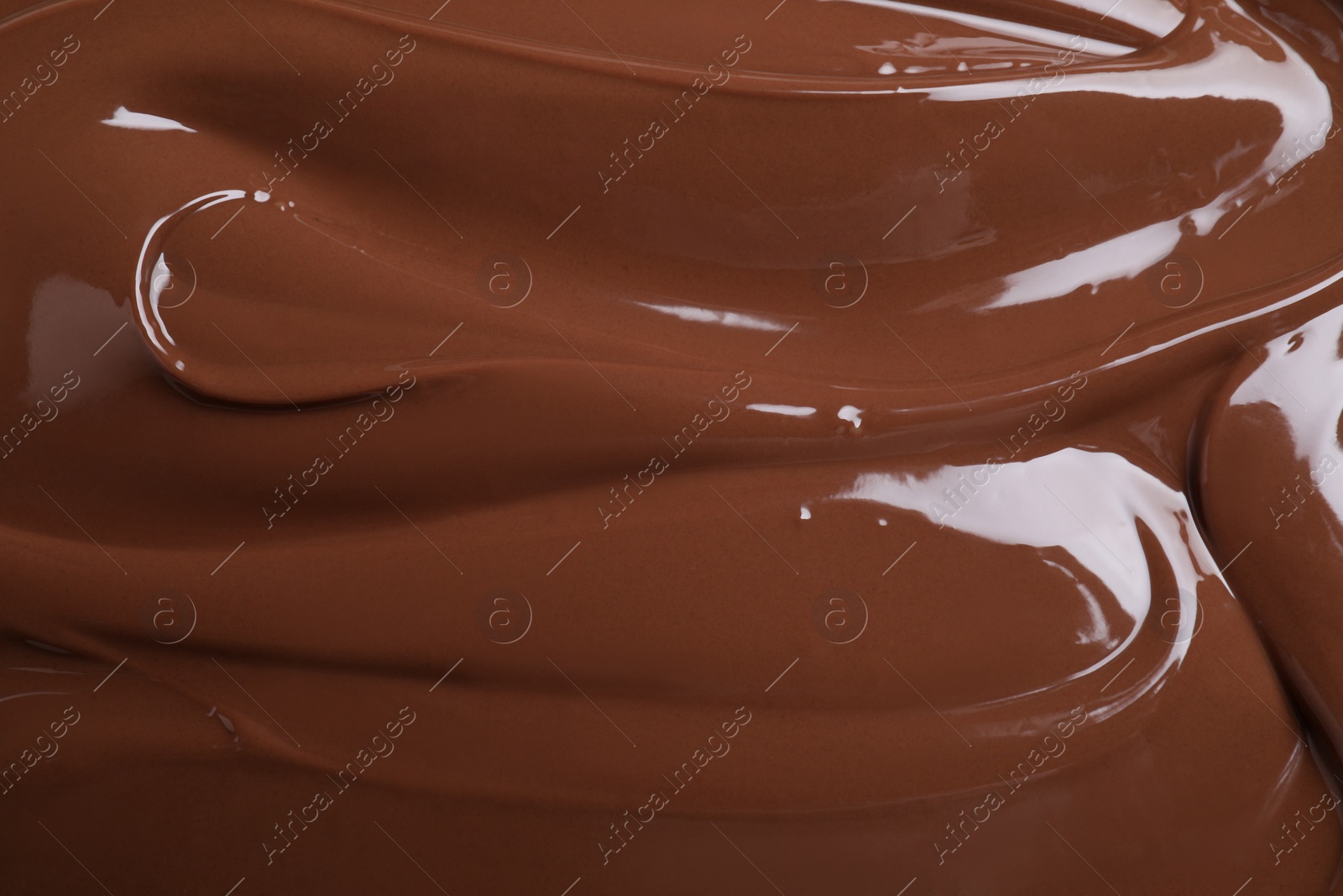 Photo of Tasty chocolate paste as background, closeup view