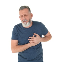 Man suffering from chest pain on white background