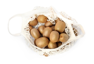 Photo of Whole fresh kiwis in net bag isolated on white, top view