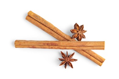 Cinnamon sticks and anise stars isolated on white, top view