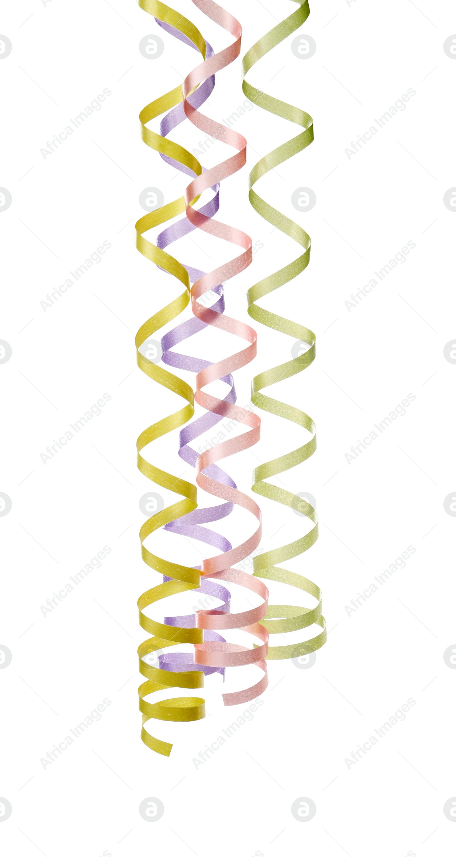 Photo of Many colorful serpentine streamers on white background