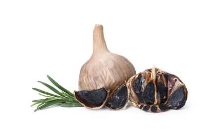 Organic fermented black garlic and rosemary isolated on white