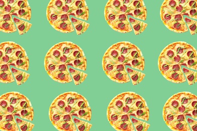 Image of Pepperoni pizza pattern design on pale green background 