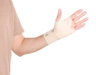 Photo of Man with hand wrapped in medical bandage on white background, closeup