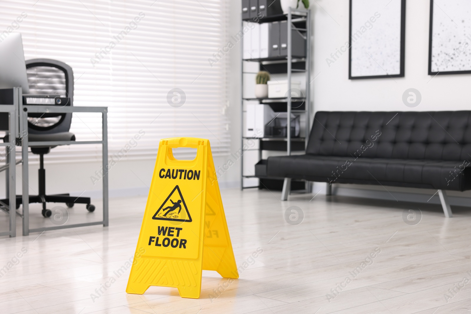 Photo of Cleaning service. Wet floor sign in office, space for text