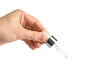 Photo of Woman holding pipette with oil on white background