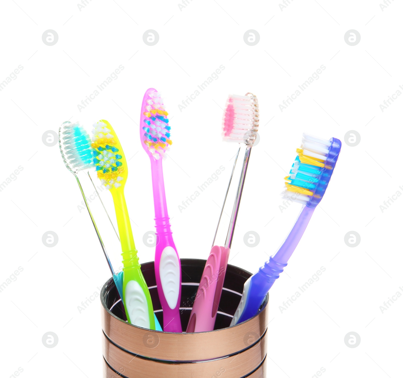 Photo of Cup with different toothbrushes on white background. Dental care