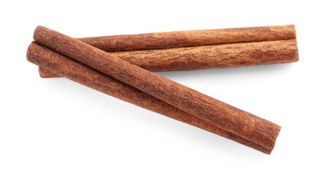 Photo of Two aromatic cinnamon sticks isolated on white