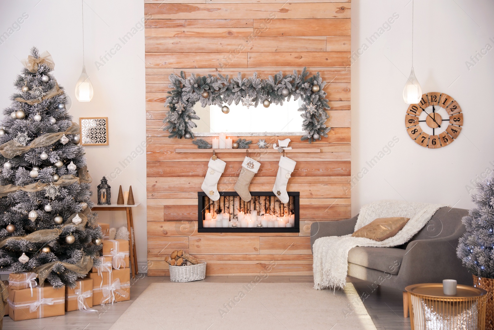 Photo of Beautiful Christmas interior of living room with decorative fireplace