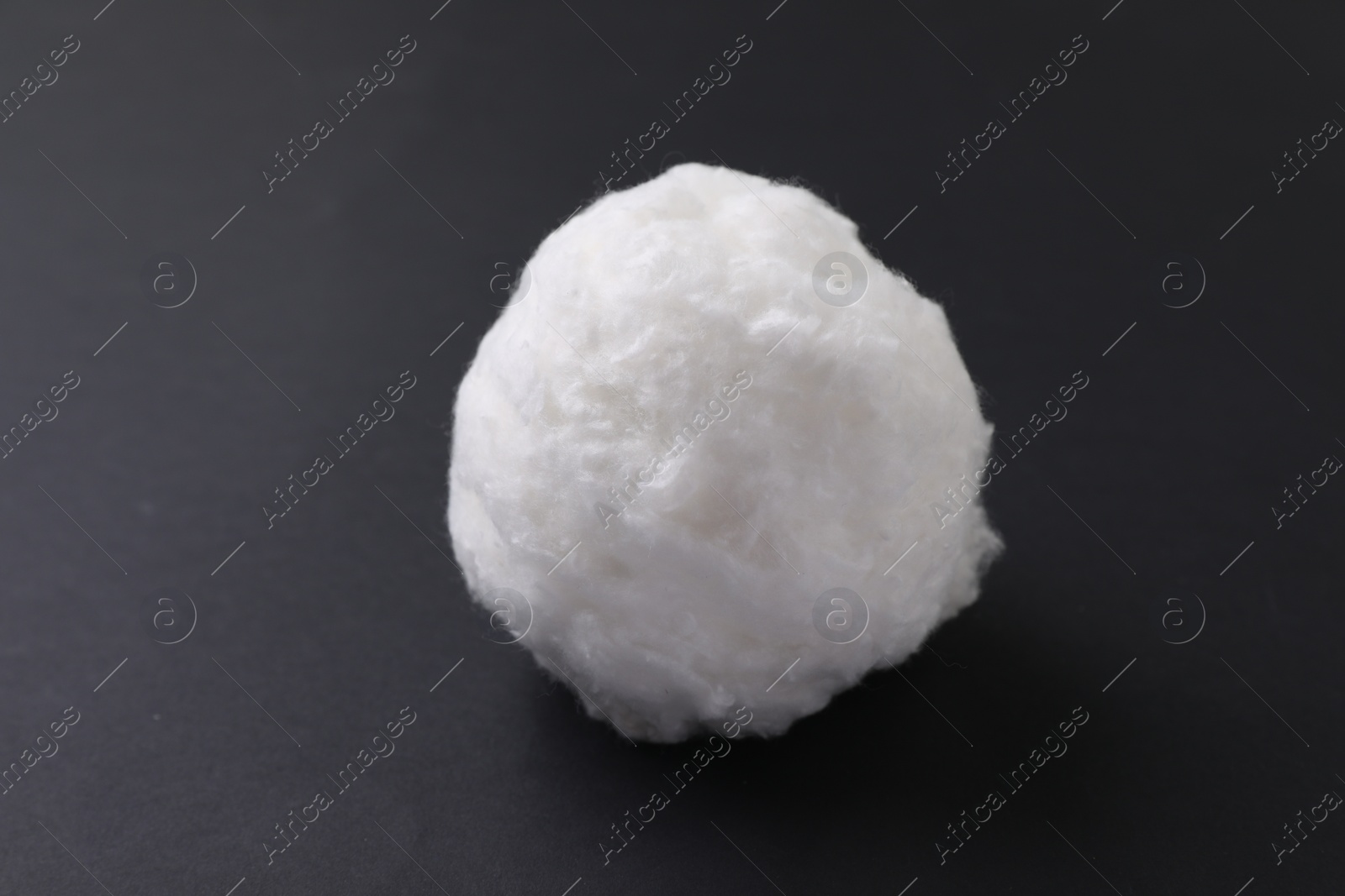 Photo of Ball of clean cotton wool on grey background, closeup