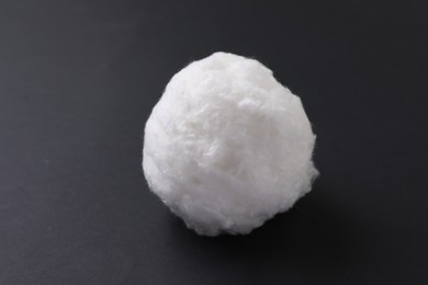 Ball of clean cotton wool on grey background, closeup