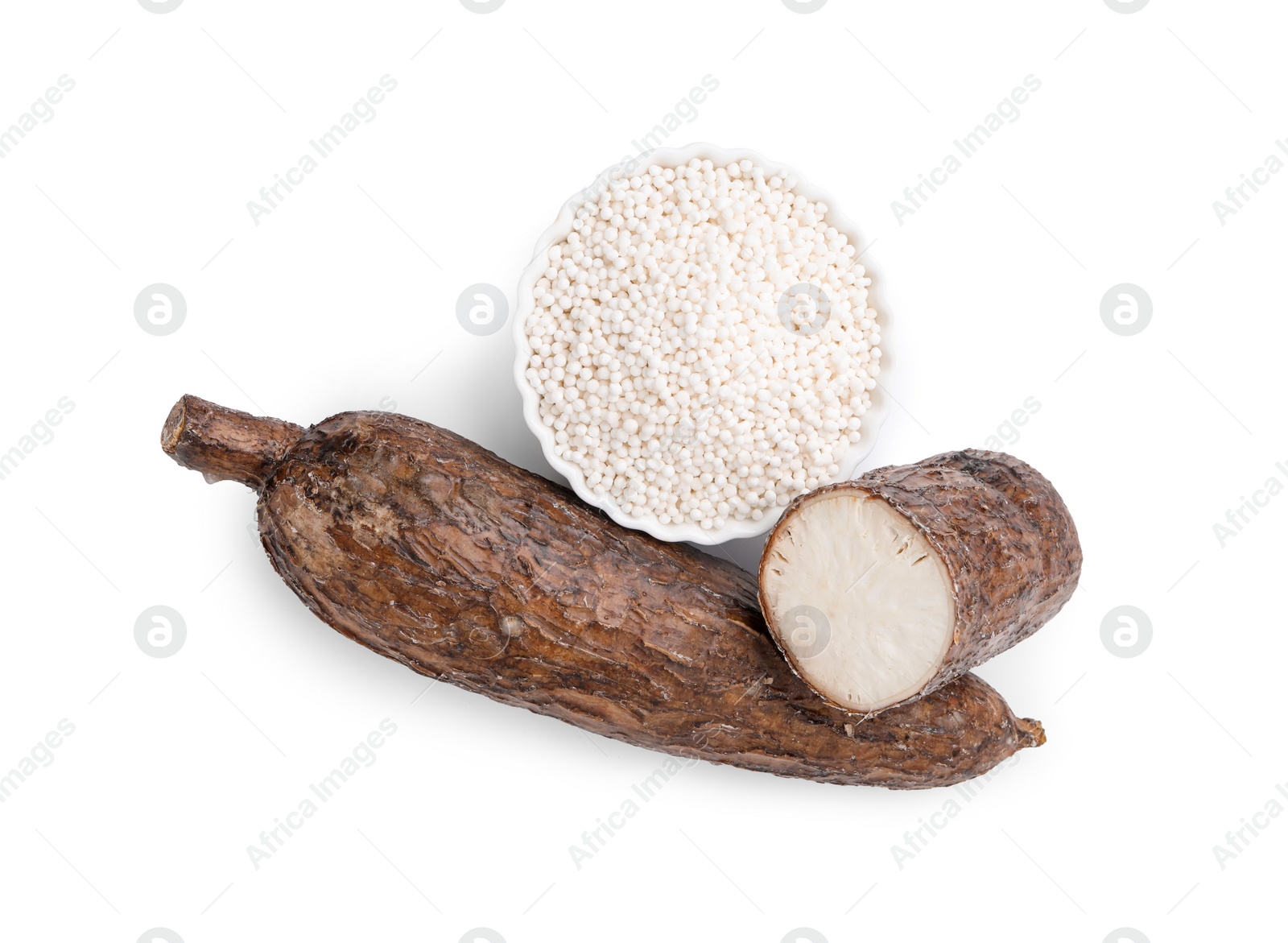 Photo of Tapioca pearls in bowl and cassava roots isolated on white, top view